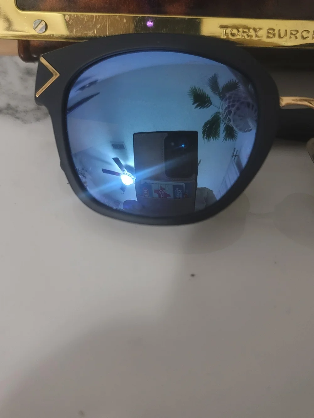 Tory Burch Black Frame Sunglasses with Blue Mirrored Lenses